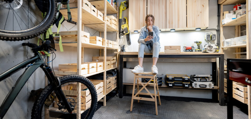 Well,equipped,home,workshop,with,bicycles,,wooden,shelves,and,woman